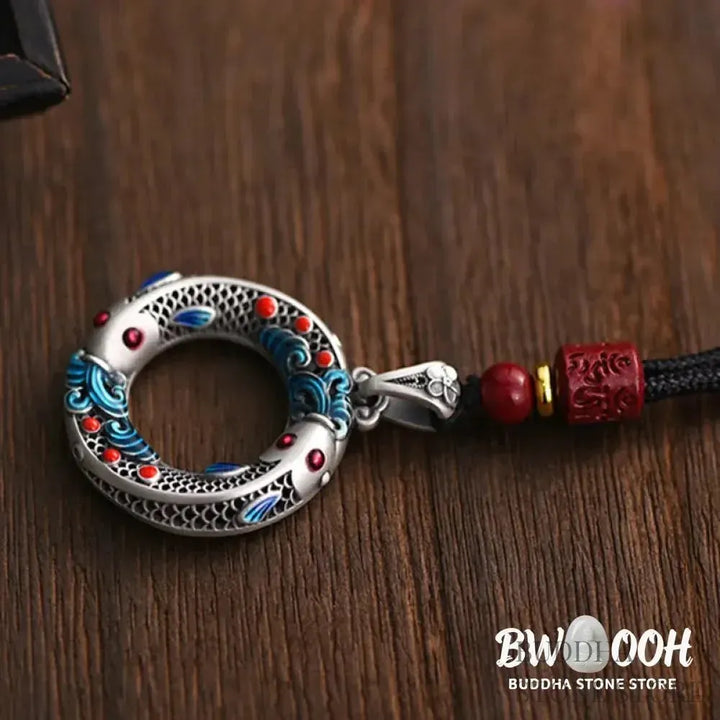 BWOOOH handcrafted copper-plated gold Koi Fish Peace Buckle necklace pendant with rope and cinnabar accents, symbolizing wealth, luck, and spiritual tranquility. A detailed 4.1x2.9cm amulet for prosperity. - View 5