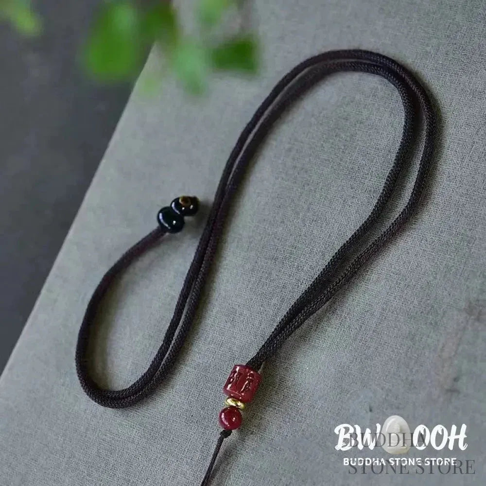 BWOOOH handcrafted copper-plated gold Koi Fish Peace Buckle necklace pendant with rope and cinnabar accents, symbolizing wealth, luck, and spiritual tranquility. A detailed 4.1x2.9cm amulet for prosperity. - View 8