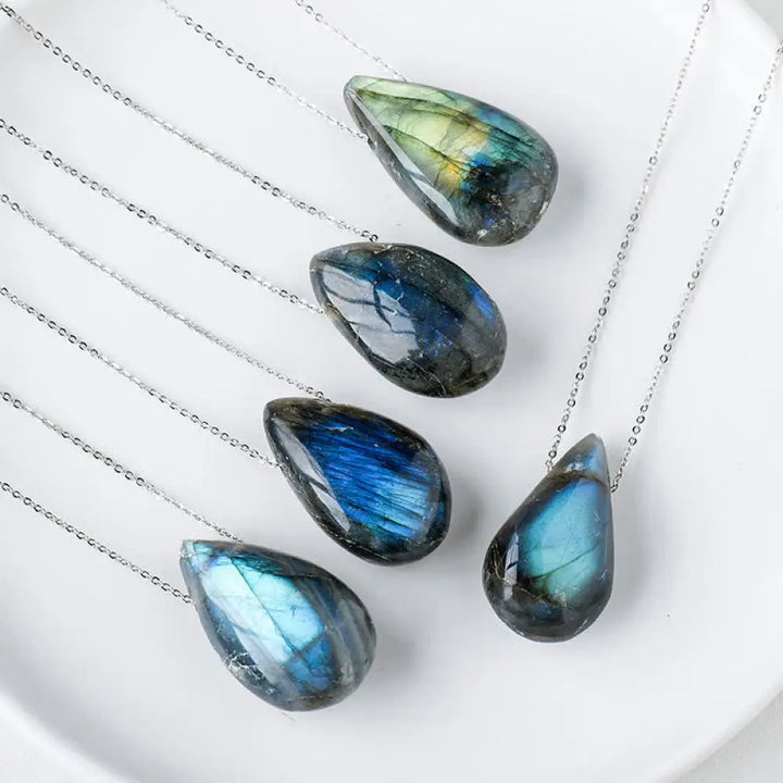 BWOOOH Labradorite Water Drop Support Healing Necklace Pendant, showcasing unique labradorescence with iridescent blue, green, and gold flashes against a dark background, embodying spiritual change and inner light.