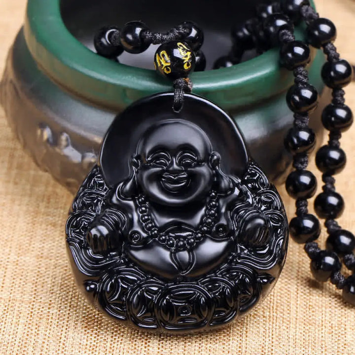 BWOOOH Laughing Buddha Black Obsidian pendant necklace, a unisex handmade spiritual amulet featuring a carved Laughing Buddha on a polished black obsidian stone, symbolizing strength, protection, and positive Feng Shui energy.