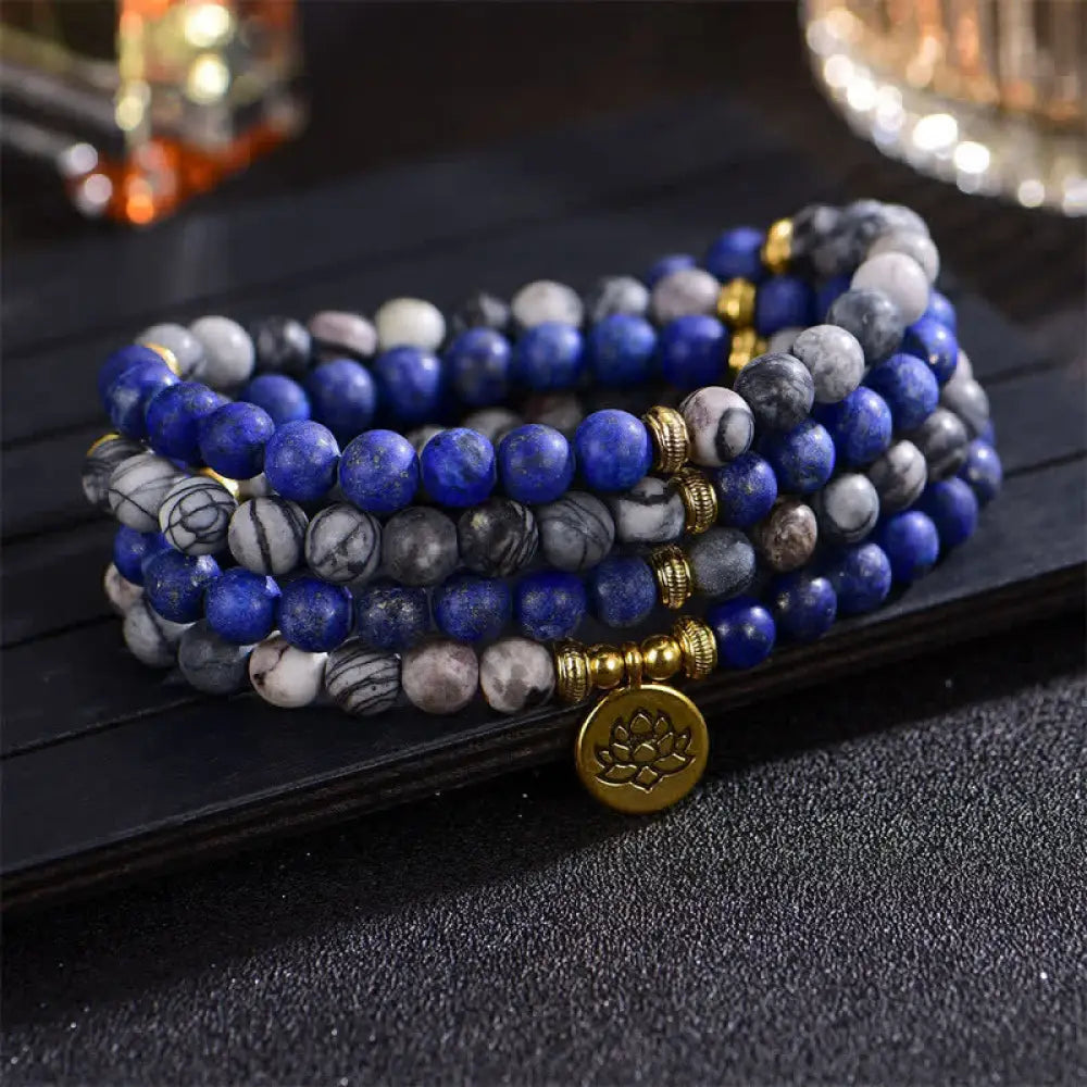 BWOOOH handcrafted 108-bead prayer bracelet featuring 8-8.5mm natural Lazurite, Picasso Jasper, Amazonite, Rhodonite, and Apatite stones on premium elastic string, adorned with a delicate Lotus symbol for spiritual balance and positive energy.