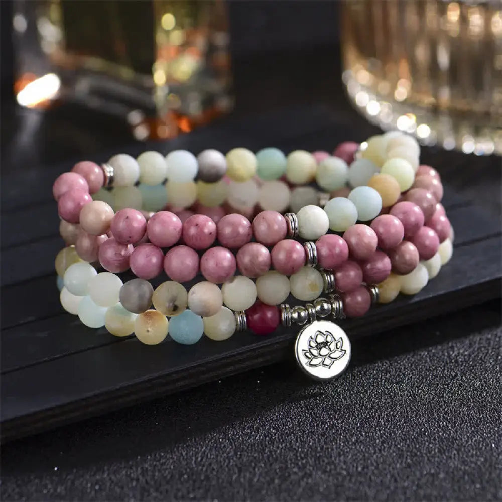 BWOOOH handcrafted 108-bead prayer bracelet featuring 8-8.5mm natural Lazurite, Picasso Jasper, Amazonite, Rhodonite, and Apatite stones on premium elastic string, adorned with a delicate Lotus symbol for spiritual balance and positive energy. - View 8