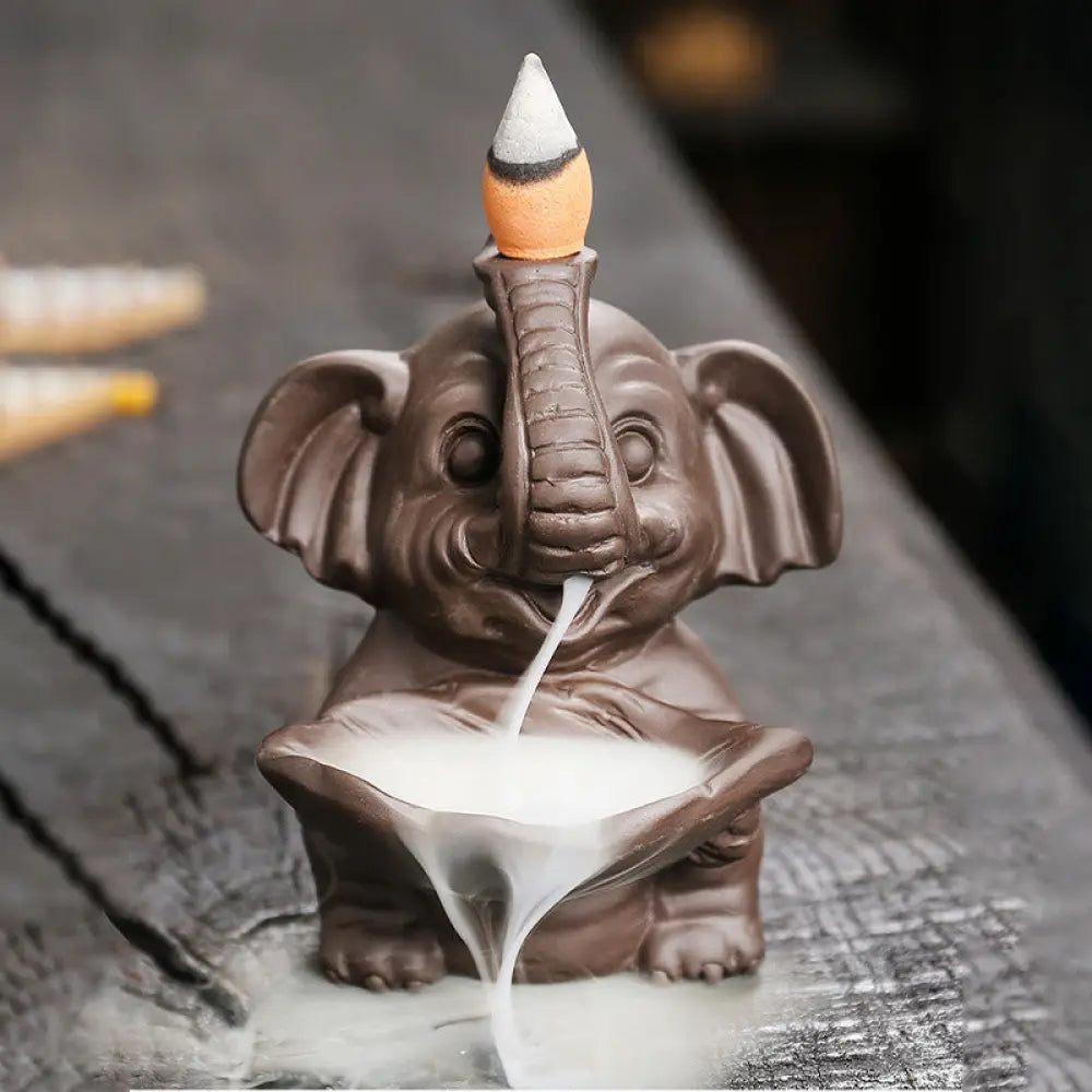BWOOOH handcrafted backflow incense burner - Little Elephant Holding Leaf Purple