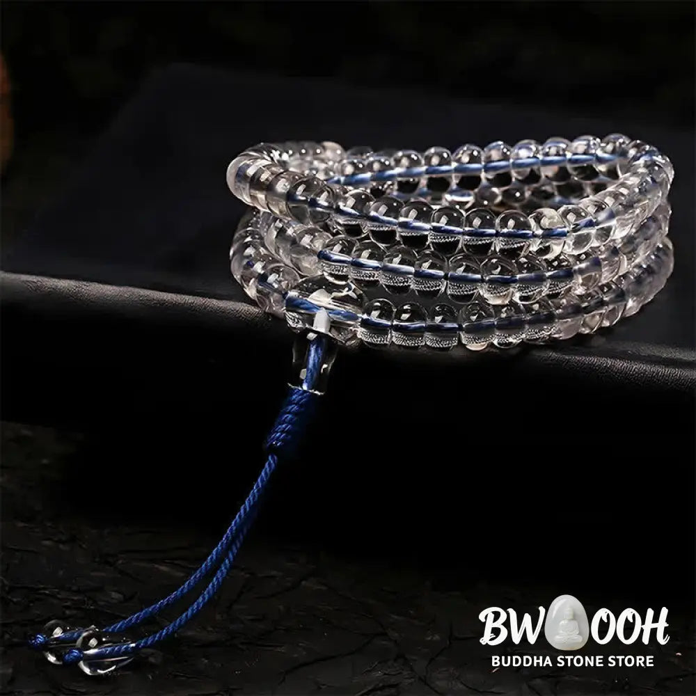 A BWOOOH Liuli 108 Flat Beads Spiral Rope Wisdom Mala, featuring translucent, multi-colored Liuli glass beads crafted with incense ash. The mala is shown wrapped several times around a wrist, ready for meditation and spiritual focus. - View 2