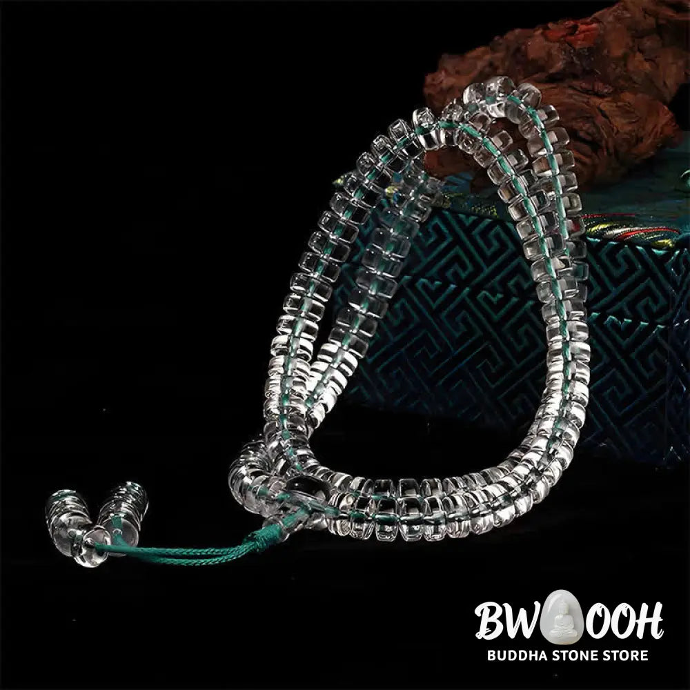 A BWOOOH Liuli 108 Flat Beads Spiral Rope Wisdom Mala, featuring translucent, multi-colored Liuli glass beads crafted with incense ash. The mala is shown wrapped several times around a wrist, ready for meditation and spiritual focus. - View 6