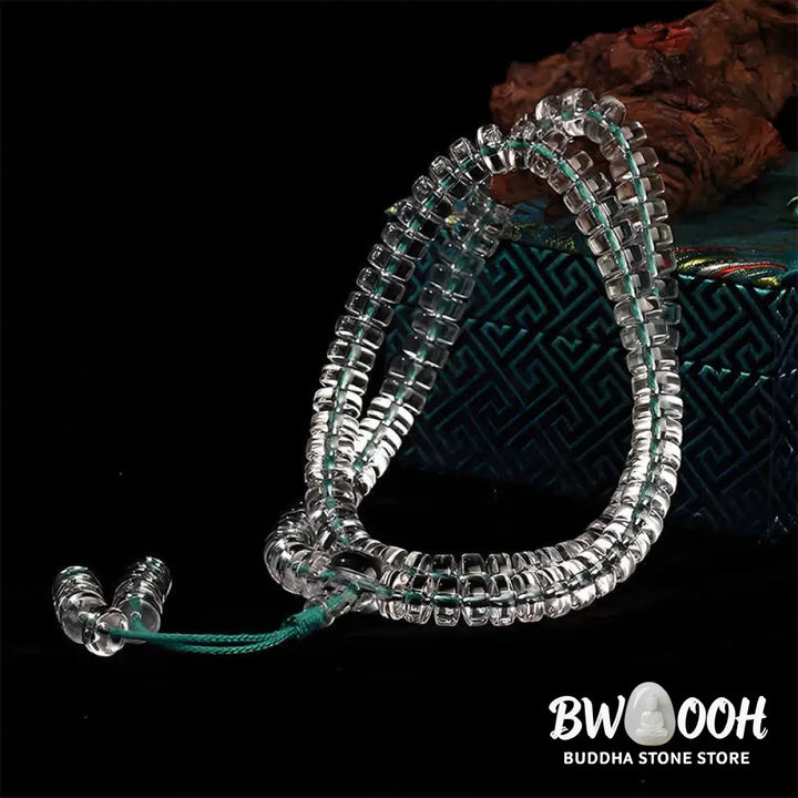 A BWOOOH Liuli 108 Flat Beads Spiral Rope Wisdom Mala, featuring translucent, multi-colored Liuli glass beads crafted with incense ash. The mala is shown wrapped several times around a wrist, ready for meditation and spiritual focus. - View 6