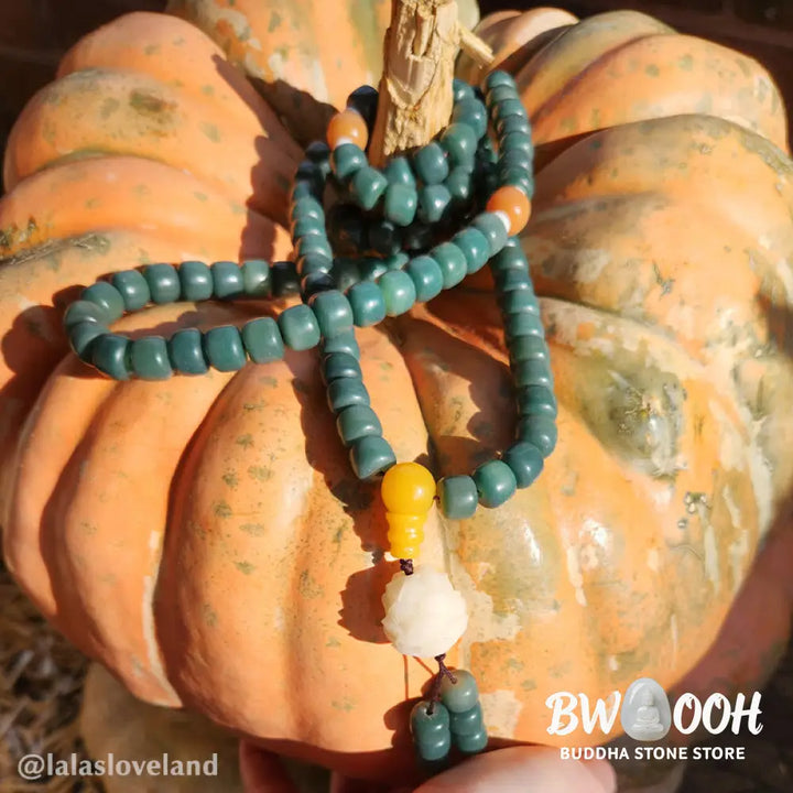 BWOOOH Lotus Cyan Bodhi Seed Success Bracelet showcasing 108 dark-speckled Bodhi seeds and an elegant Lotus symbol. Handcrafted unisex spiritual mala for wisdom, peace, and resilience. - View 3