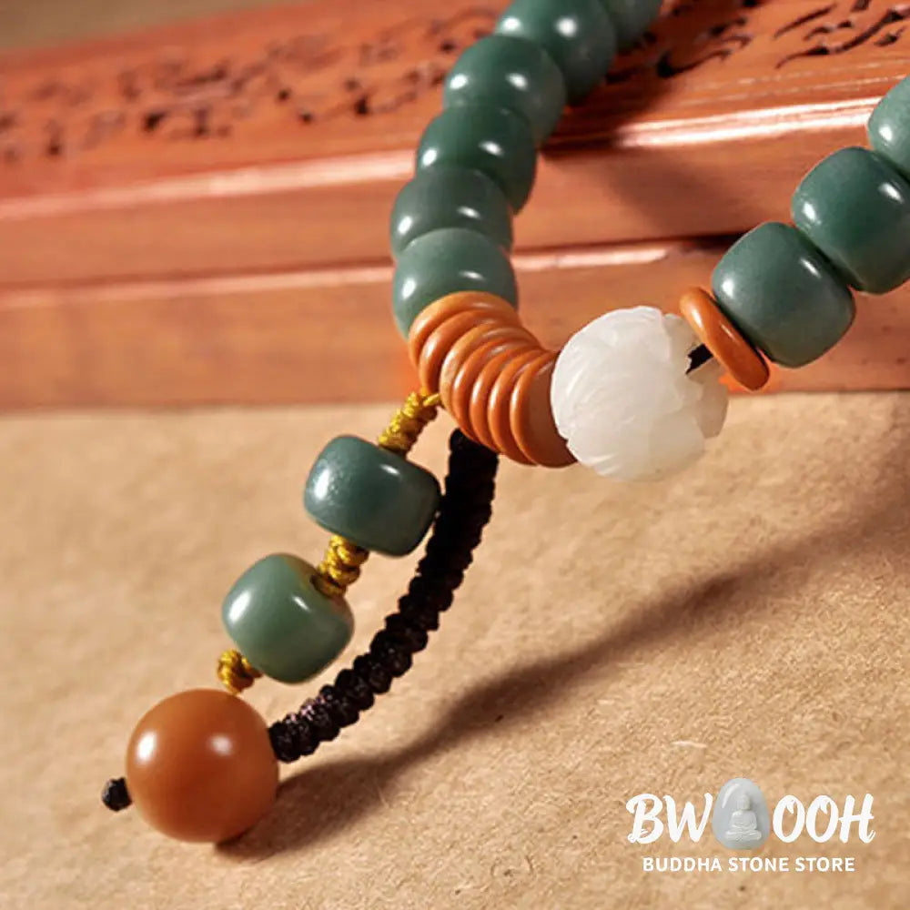 BWOOOH Lotus Cyan Bodhi Seed Success Bracelet showcasing 108 dark-speckled Bodhi seeds and an elegant Lotus symbol. Handcrafted unisex spiritual mala for wisdom, peace, and resilience. - View 6