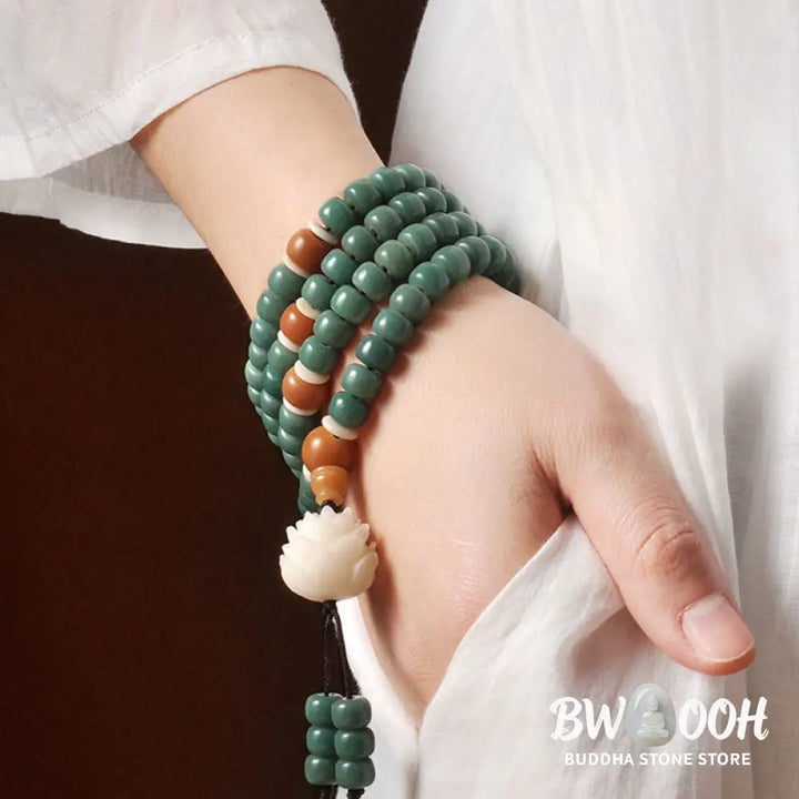 BWOOOH Lotus Cyan Bodhi Seed Success Bracelet showcasing 108 dark-speckled Bodhi seeds and an elegant Lotus symbol. Handcrafted unisex spiritual mala for wisdom, peace, and resilience. - View 8