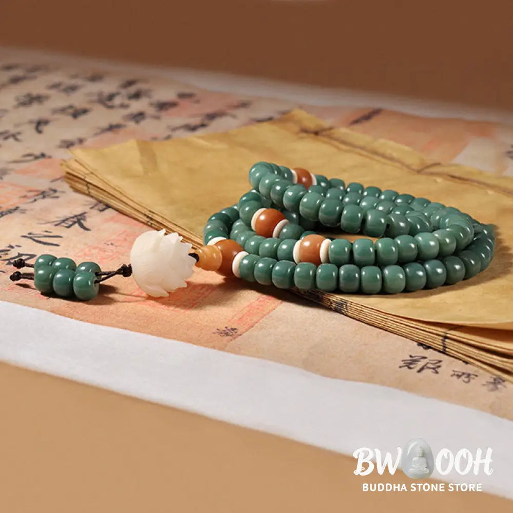 BWOOOH Lotus Cyan Bodhi Seed Success Bracelet showcasing 108 dark-speckled Bodhi seeds and an elegant Lotus symbol. Handcrafted unisex spiritual mala for wisdom, peace, and resilience. - View 4