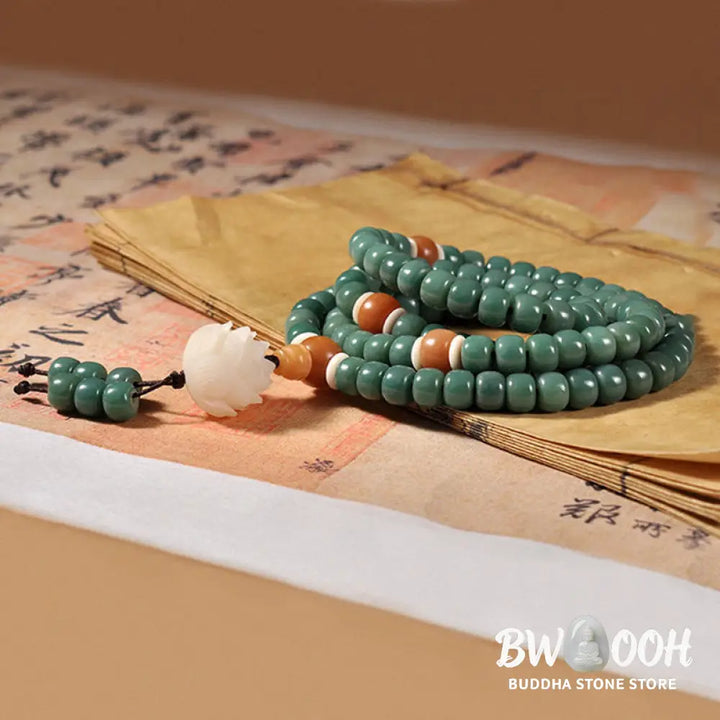 BWOOOH Lotus Cyan Bodhi Seed Success Bracelet showcasing 108 dark-speckled Bodhi seeds and an elegant Lotus symbol. Handcrafted unisex spiritual mala for wisdom, peace, and resilience. - View 4