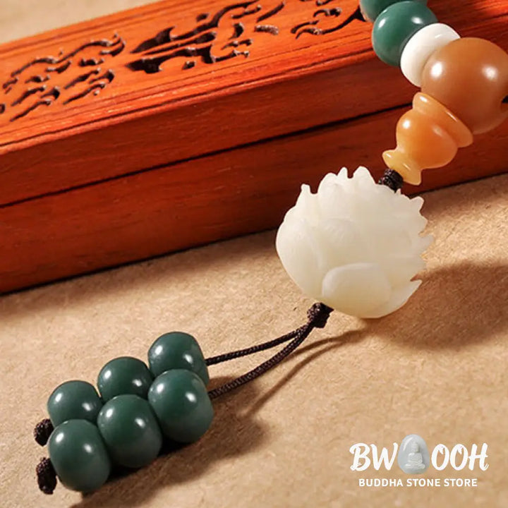 BWOOOH Lotus Cyan Bodhi Seed Success Bracelet showcasing 108 dark-speckled Bodhi seeds and an elegant Lotus symbol. Handcrafted unisex spiritual mala for wisdom, peace, and resilience. - View 5