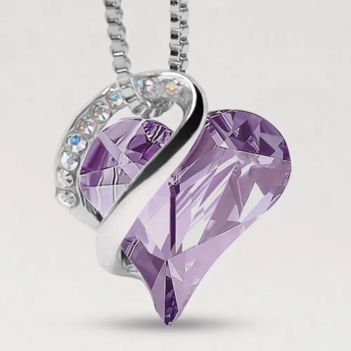 A BWOOOH Love Heart Birthstone Necklace pendant featuring a vibrant, wild-heart-shaped premium crystal, elegantly embraced by a silver-tone ribbon forming an infinity symbol, symbolizing triumph of love and eternal spiritual connection. - View 23