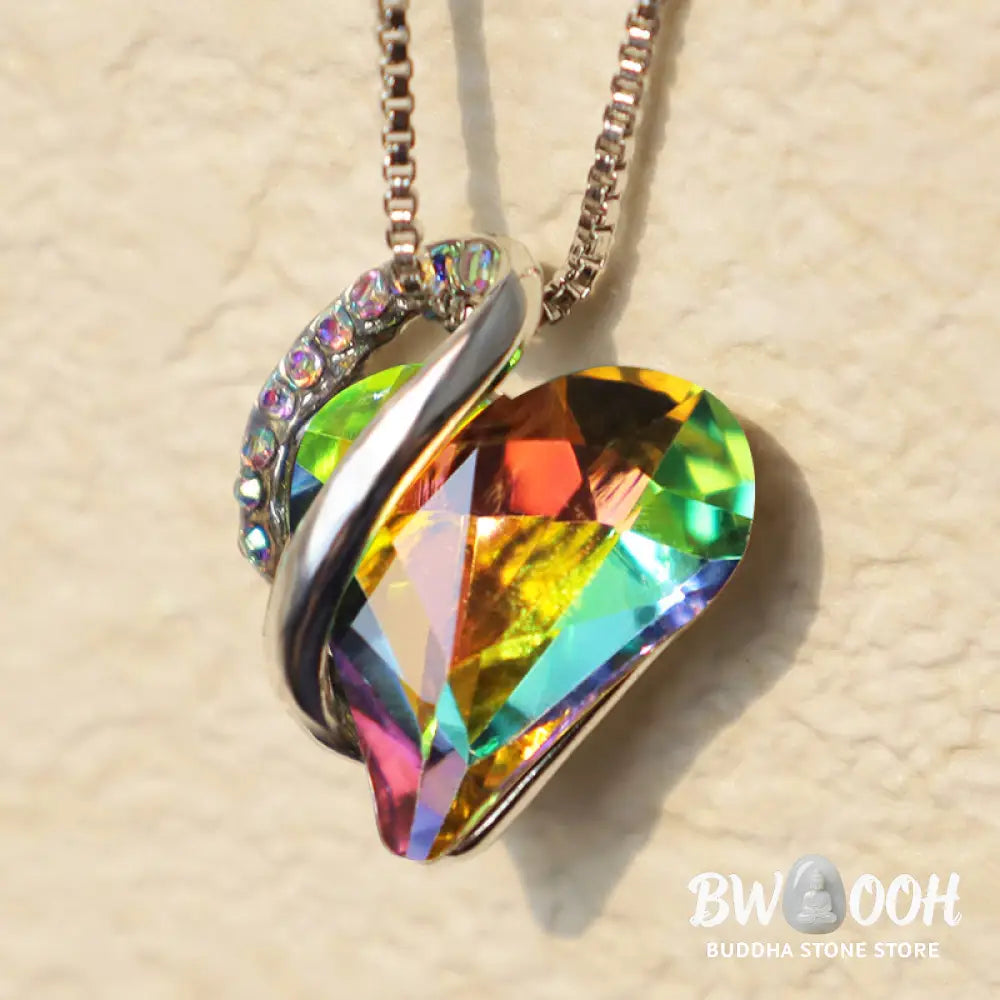 A BWOOOH Love Heart Birthstone Necklace pendant featuring a vibrant, wild-heart-shaped premium crystal, elegantly embraced by a silver-tone ribbon forming an infinity symbol, symbolizing triumph of love and eternal spiritual connection. - View 48