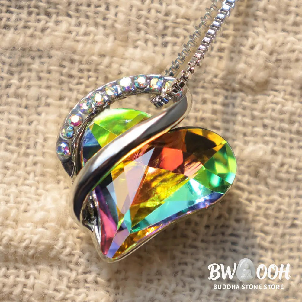 A BWOOOH Love Heart Birthstone Necklace pendant featuring a vibrant, wild-heart-shaped premium crystal, elegantly embraced by a silver-tone ribbon forming an infinity symbol, symbolizing triumph of love and eternal spiritual connection. - View 47