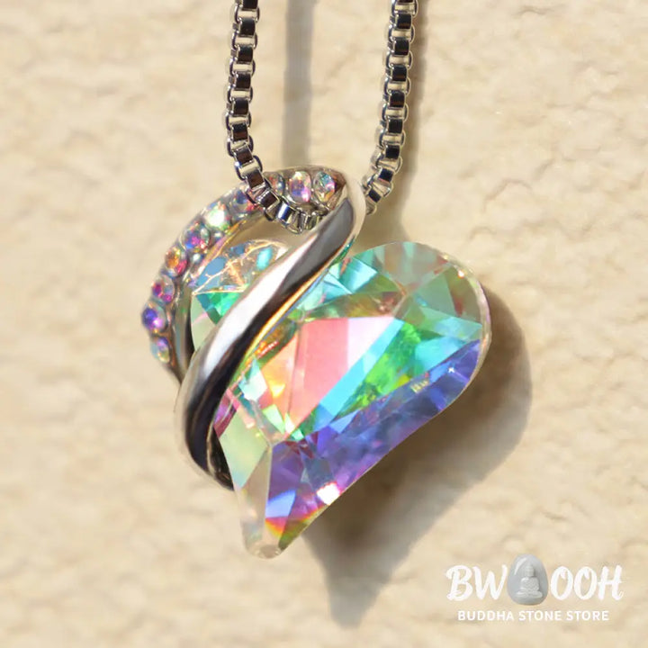 A BWOOOH Love Heart Birthstone Necklace pendant featuring a vibrant, wild-heart-shaped premium crystal, elegantly embraced by a silver-tone ribbon forming an infinity symbol, symbolizing triumph of love and eternal spiritual connection. - View 17