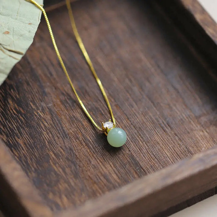BWOOOH Lucky Bead Jade Prosperity Chain Necklace Pendant, featuring polished jade beads and a central jade pendant, with a 925 Sterling Silver clasp, symbolizing luck and prosperity.