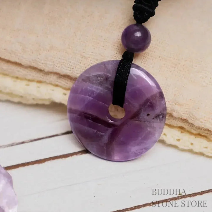 A BWOOOH Lucky Coin Pendant Necklace featuring a round, polished gemstone pendant, approximately 1.18 inches in diameter, suspended on a 26-inch chain, showcasing materials such as Green Aventurine, Pink Crystal, Black Onyx, and Jade, designed for spiritual wellness and good fortune. - View 6