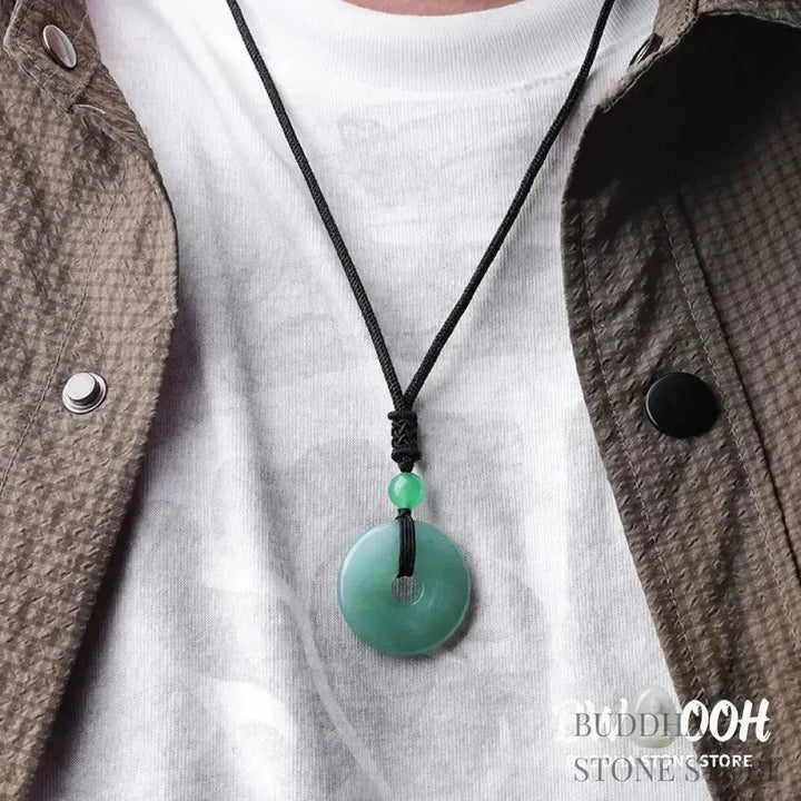 A BWOOOH Lucky Coin Pendant Necklace featuring a round, polished gemstone pendant, approximately 1.18 inches in diameter, suspended on a 26-inch chain, showcasing materials such as Green Aventurine, Pink Crystal, Black Onyx, and Jade, designed for spiritual wellness and good fortune. - View 4