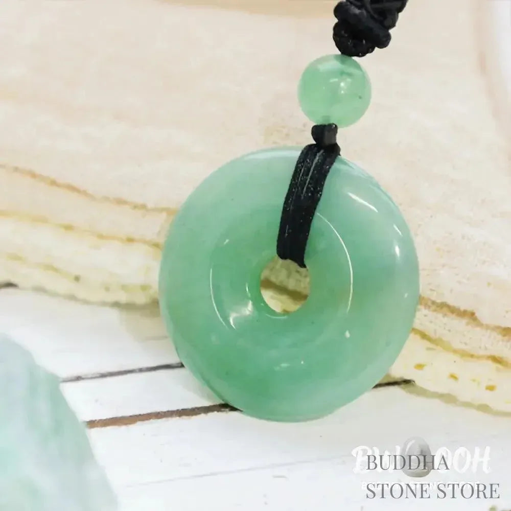 A BWOOOH Lucky Coin Pendant Necklace featuring a round, polished gemstone pendant, approximately 1.18 inches in diameter, suspended on a 26-inch chain, showcasing materials such as Green Aventurine, Pink Crystal, Black Onyx, and Jade, designed for spiritual wellness and good fortune. - View 3