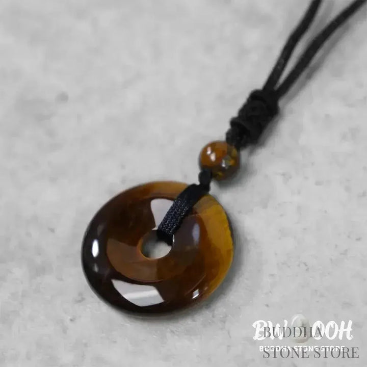 A BWOOOH Lucky Coin Pendant Necklace featuring a round, polished gemstone pendant, approximately 1.18 inches in diameter, suspended on a 26-inch chain, showcasing materials such as Green Aventurine, Pink Crystal, Black Onyx, and Jade, designed for spiritual wellness and good fortune. - View 21