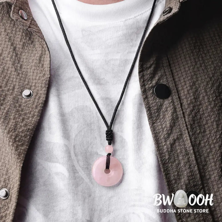 A BWOOOH Lucky Coin Pendant Necklace featuring a round, polished gemstone pendant, approximately 1.18 inches in diameter, suspended on a 26-inch chain, showcasing materials such as Green Aventurine, Pink Crystal, Black Onyx, and Jade, designed for spiritual wellness and good fortune. - View 12