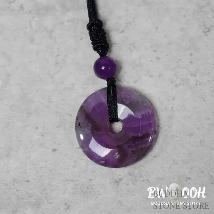 A BWOOOH Lucky Coin Pendant Necklace featuring a round, polished gemstone pendant, approximately 1.18 inches in diameter, suspended on a 26-inch chain, showcasing materials such as Green Aventurine, Pink Crystal, Black Onyx, and Jade, designed for spiritual wellness and good fortune. - View 7