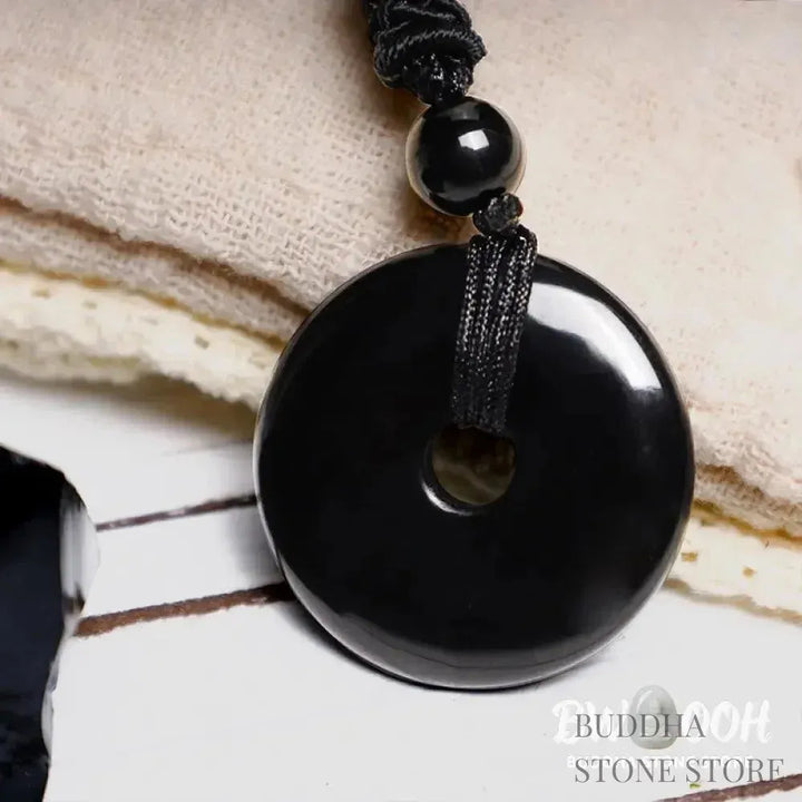 A BWOOOH Lucky Coin Pendant Necklace featuring a round, polished gemstone pendant, approximately 1.18 inches in diameter, suspended on a 26-inch chain, showcasing materials such as Green Aventurine, Pink Crystal, Black Onyx, and Jade, designed for spiritual wellness and good fortune. - View 15