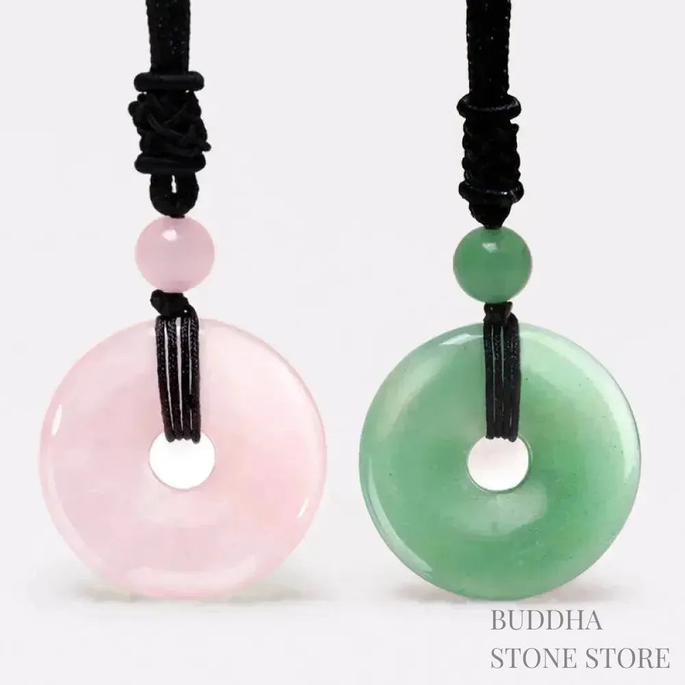 A BWOOOH Lucky Coin Pendant Necklace featuring a round, polished gemstone pendant, approximately 1.18 inches in diameter, suspended on a 26-inch chain, showcasing materials such as Green Aventurine, Pink Crystal, Black Onyx, and Jade, designed for spiritual wellness and good fortune.