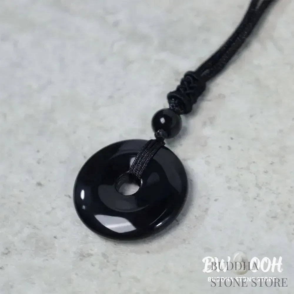 A BWOOOH Lucky Coin Pendant Necklace featuring a round, polished gemstone pendant, approximately 1.18 inches in diameter, suspended on a 26-inch chain, showcasing materials such as Green Aventurine, Pink Crystal, Black Onyx, and Jade, designed for spiritual wellness and good fortune. - View 16