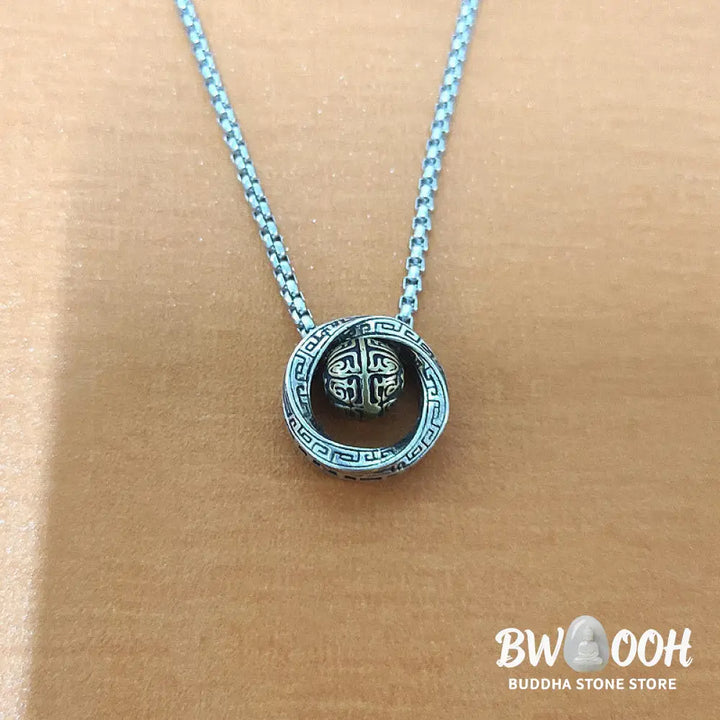 A close-up of the BWOOOH Mobius Lucky Bead Copper Wealth Necklace Pendant, featuring a polished 20mm Mobius copper symbol on a 60cm chain, evoking spiritual grounding and prosperity. - View 8