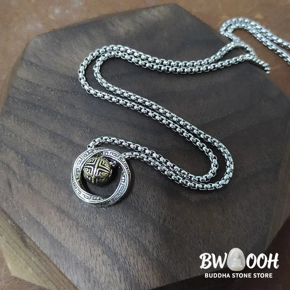 A close-up of the BWOOOH Mobius Lucky Bead Copper Wealth Necklace Pendant, featuring a polished 20mm Mobius copper symbol on a 60cm chain, evoking spiritual grounding and prosperity. - View 6