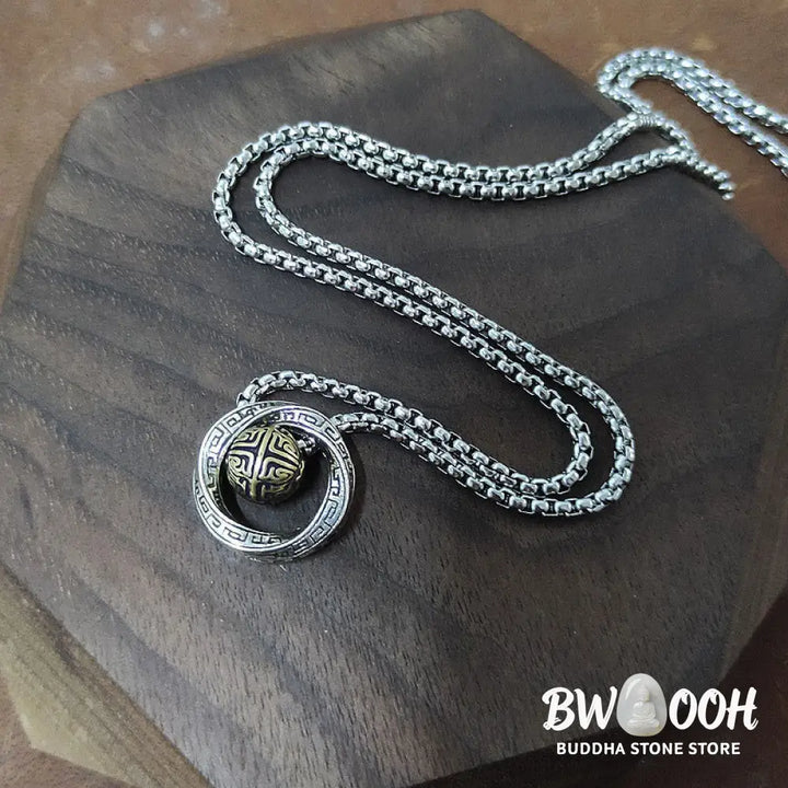 A close-up of the BWOOOH Mobius Lucky Bead Copper Wealth Necklace Pendant, featuring a polished 20mm Mobius copper symbol on a 60cm chain, evoking spiritual grounding and prosperity. - View 6