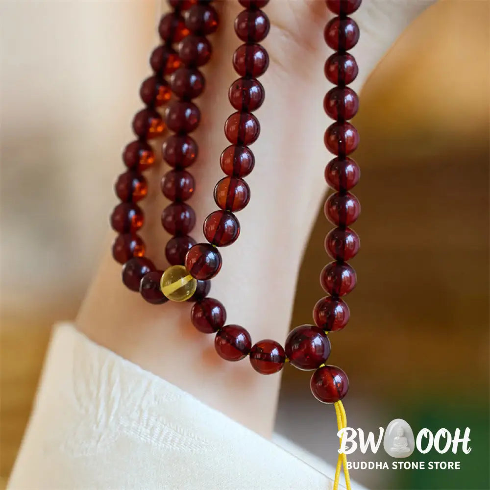 BWOOOH Natural Amber 108 Mala Beads anxiety bracelet featuring clear, luminous 6.5mm amber beads on premium string, designed for meditation and focus. - View 3