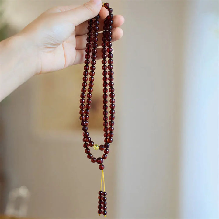 BWOOOH Natural Amber 108 Mala Beads anxiety bracelet featuring clear, luminous 6.5mm amber beads on premium string, designed for meditation and focus.