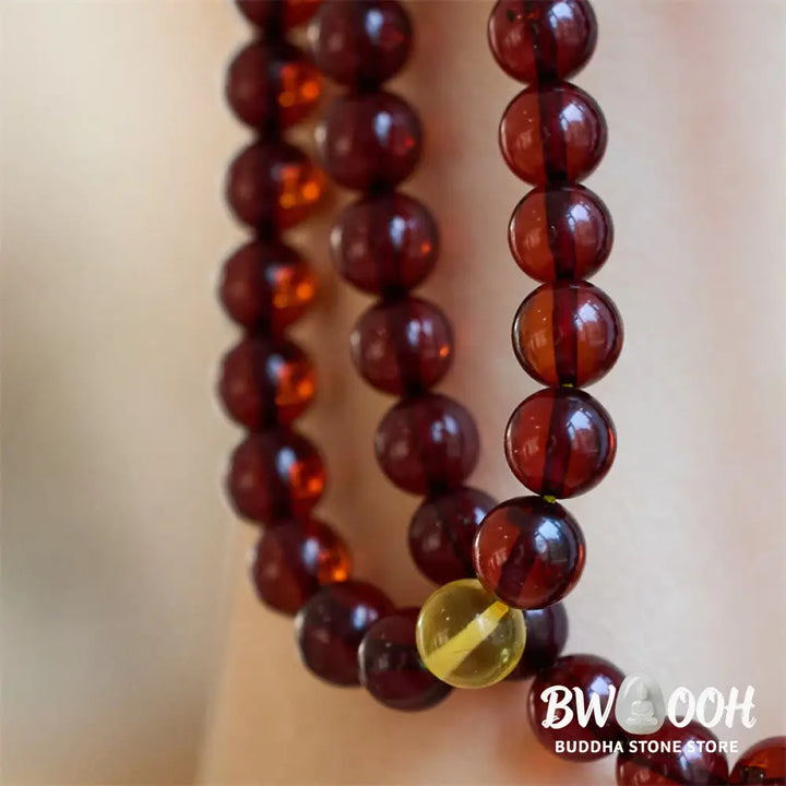 BWOOOH Natural Amber 108 Mala Beads anxiety bracelet featuring clear, luminous 6.5mm amber beads on premium string, designed for meditation and focus. - View 4