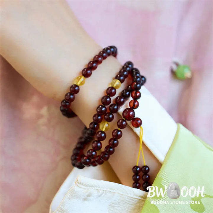 BWOOOH Natural Amber 108 Mala Beads anxiety bracelet featuring clear, luminous 6.5mm amber beads on premium string, designed for meditation and focus. - View 5
