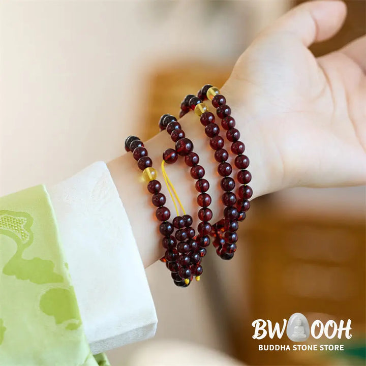 BWOOOH Natural Amber 108 Mala Beads anxiety bracelet featuring clear, luminous 6.5mm amber beads on premium string, designed for meditation and focus. - View 2