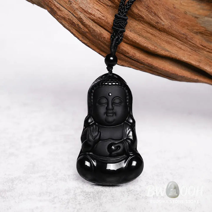 A BWOOOH Natural Black Obsidian Crystal Buddha Strength Protection Amulet Lucky Charm Pendant Necklace, featuring a 5.3x3.1cm carved Buddha pendant on a 64cm perimeter necklace, against a neutral background. - View 4