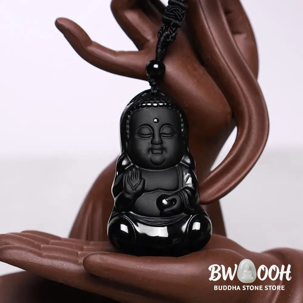 A BWOOOH Natural Black Obsidian Crystal Buddha Strength Protection Amulet Lucky Charm Pendant Necklace, featuring a 5.3x3.1cm carved Buddha pendant on a 64cm perimeter necklace, against a neutral background. - View 3