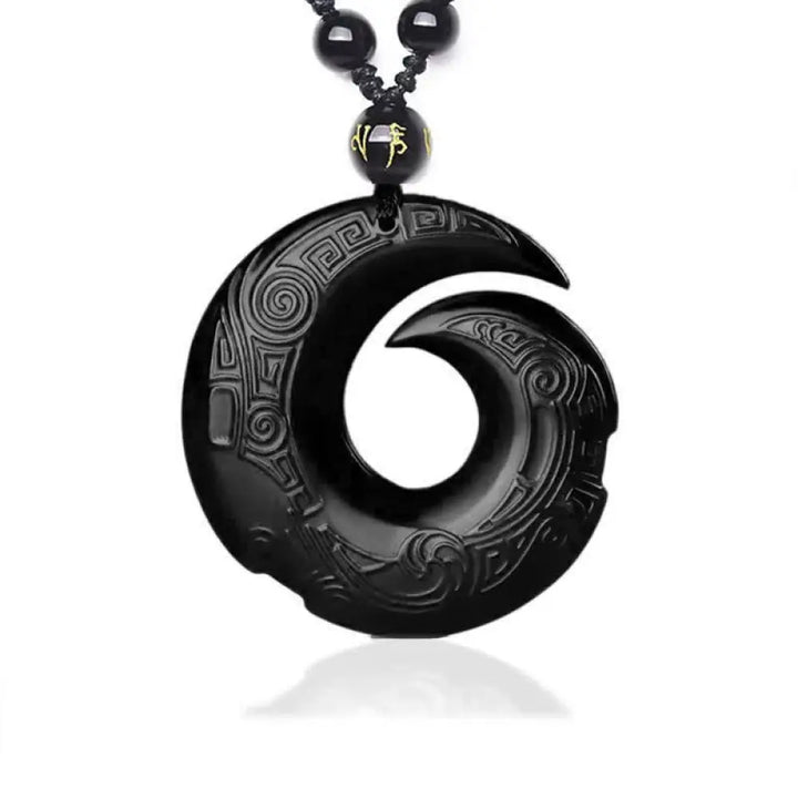 BWOOOH Natural Black Obsidian and Ice Obsidian Peace Buckle Strength Necklace Pendant, showcasing a polished black obsidian stone adjacent to a translucent ice obsidian peace buckle on an adjustable cord.