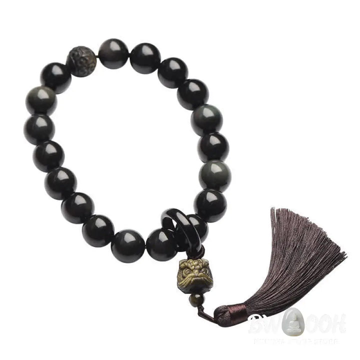 A BWOOOH Natural Black Obsidian Lion Wrist Mala with protection tassels, shown as a pocket mala and car decoration, embodying courage, wisdom, and spiritual enlightenment for energetic protection and positive Feng Shui. - View 7