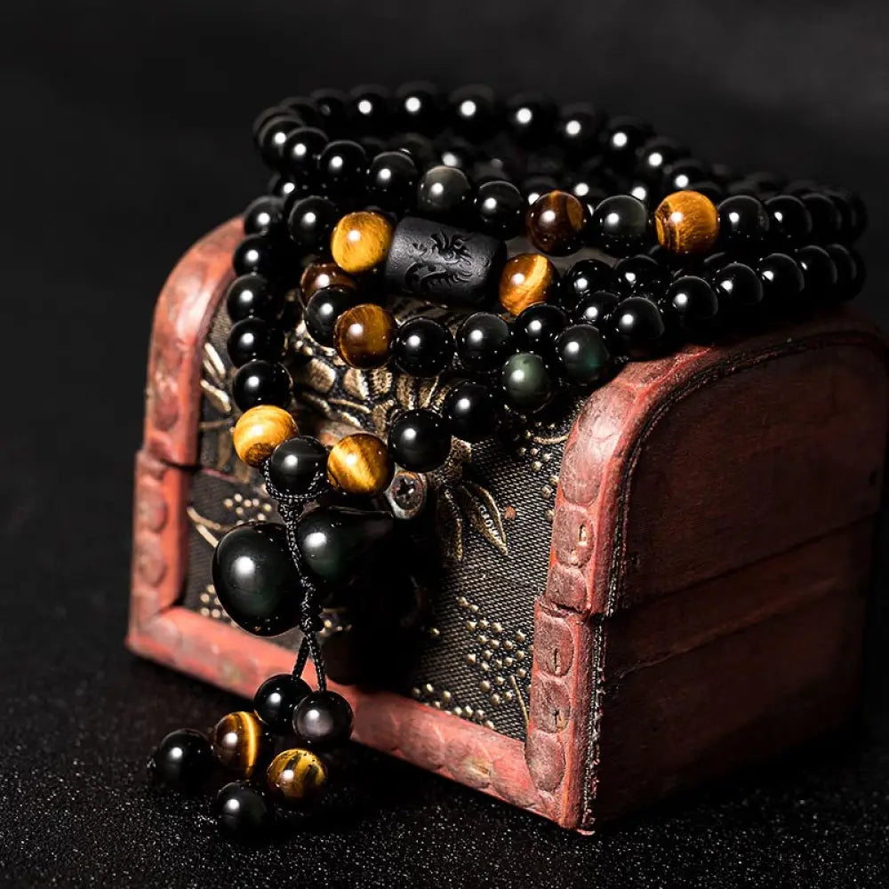 BWOOOH Natural Black Obsidian Rainbow Obsidian Gourd Blessing Mala Bracelet, 108 beads (6mm), showcasing iridescent flashes and a sacred gourd charm for spiritual protection and meditative practice.