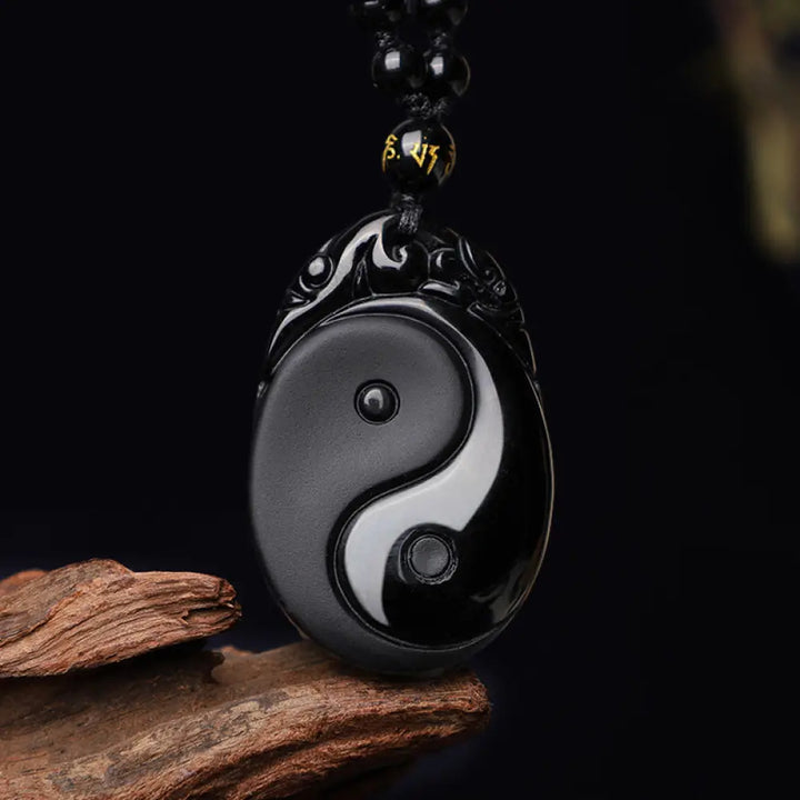 BWOOOH Natural Black Obsidian Yin Yang Fulfilment Strength Necklace Pendant. Grounding protection crystal for positive Feng Shui energy and spiritual balance. Hand-carved.