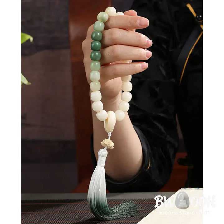 BWOOOH Natural Gradient Bodhi Seed Fortune Money Bag Lotus Wisdom Tassel Wrist Mala featuring 12mm dark-speckled bodhi seeds, boxwood, agate, and green aventurine; a handcrafted spiritual meditation bracelet for wisdom and calm. - View 19