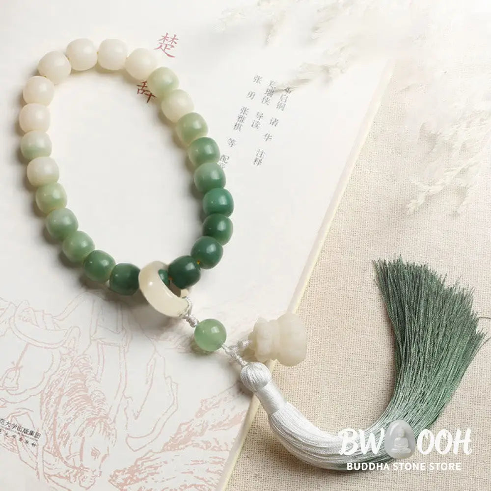 BWOOOH Natural Gradient Bodhi Seed Fortune Money Bag Lotus Wisdom Tassel Wrist Mala featuring 12mm dark-speckled bodhi seeds, boxwood, agate, and green aventurine; a handcrafted spiritual meditation bracelet for wisdom and calm. - View 6