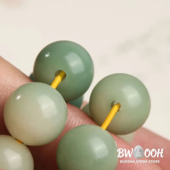 BWOOOH Natural Gradient Bodhi Seed Fortune Money Bag Lotus Wisdom Tassel Wrist Mala featuring 12mm dark-speckled bodhi seeds, boxwood, agate, and green aventurine; a handcrafted spiritual meditation bracelet for wisdom and calm. - View 21