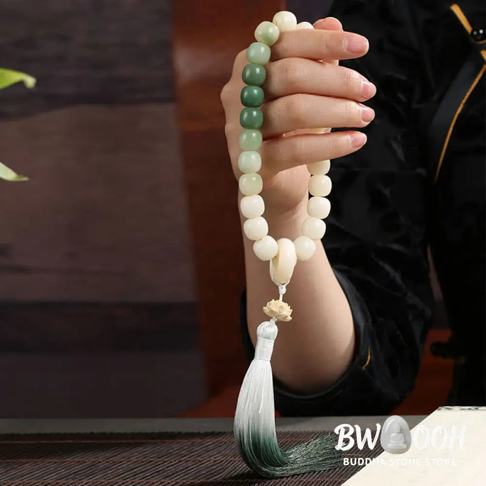 BWOOOH Natural Gradient Bodhi Seed Fortune Money Bag Lotus Wisdom Tassel Wrist Mala featuring 12mm dark-speckled bodhi seeds, boxwood, agate, and green aventurine; a handcrafted spiritual meditation bracelet for wisdom and calm. - View 13