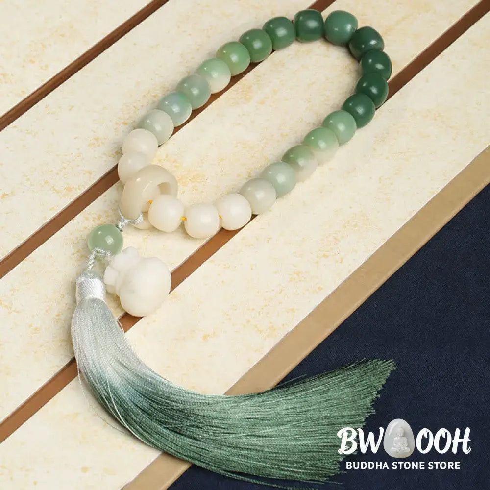 BWOOOH Natural Gradient Bodhi Seed Fortune Money Bag Lotus Wisdom Tassel Wrist Mala featuring 12mm dark-speckled bodhi seeds, boxwood, agate, and green aventurine; a handcrafted spiritual meditation bracelet for wisdom and calm. - View 2