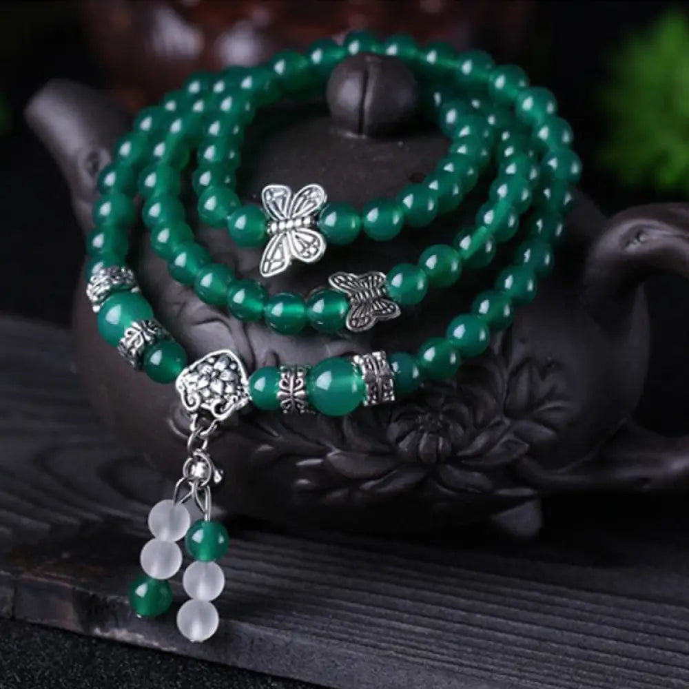 BWOOOH Natural Green Agate Butterfly Support Bracelet featuring 6mm green agate beads and a delicate copper alloy butterfly charm on elastic string, symbolizing transformation, courage, and spiritual balance.